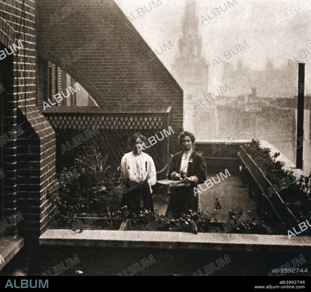 Emmeline and Christabel Pankhurst, British suffragettes, London, 12 October 1908. Emmeline Pankhurst (1858-1928) and her daughter Christabel Pankhurst (1880-1958) hiding in the roof garden at Clement's Inn after the police issued a summons for them in response to the pamphlet they had distributed in support of a 'rush' of the House of Commons.