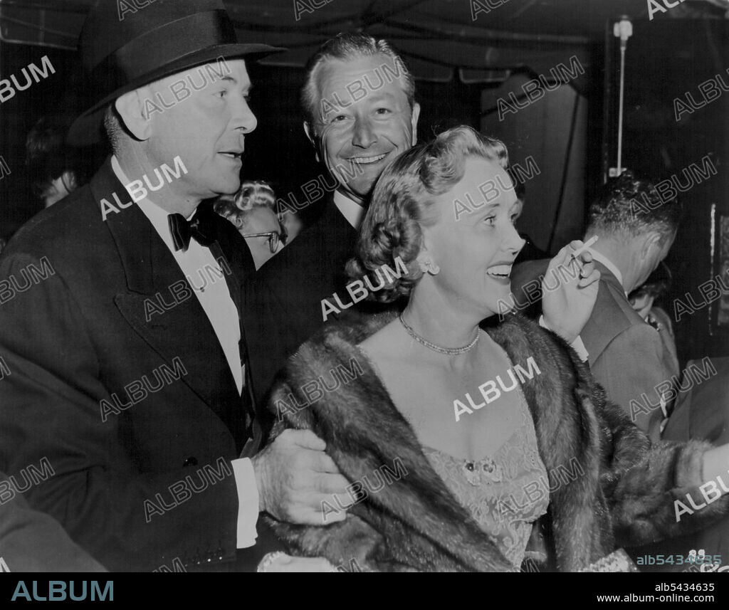 Dean Jagger with Mr. and Mrs. Robert Young at Robe Hollywood Premiere. November 22, 1954.