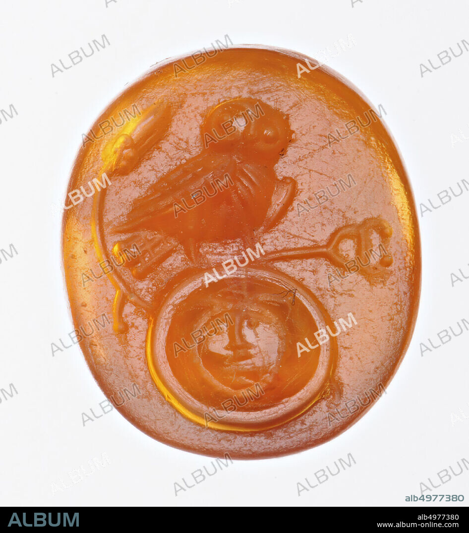 Vz: an owl sits on a round shield, decorated with a Medusa head, a caduceus for the owl, an ear of corn behind the owl, gem, intaglio, ringstone, carnelian, to the right, Color: orange-red, Shape: oval, Machined: Maaskant-Kleibrink, M., Catalog of the engraved gems in the Royal Coin Cabinet, 1978, p.60, fig.2, type F1, rounded edge, Method: modeling with large drills, detailing with many , 13.5 x 11 mm, D. 2.5 mm, 2nd and 1st century BC. -200.