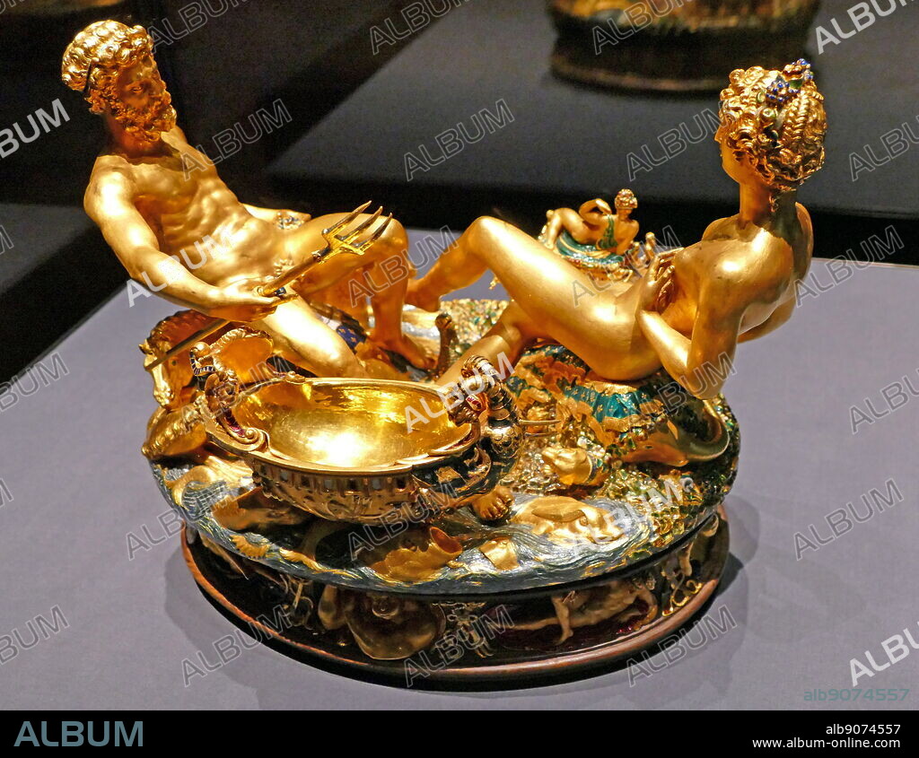 Photograph of the Cellini Salt Cellar (Saliera), a part-enamelled gold table sculpture, by Benvenuto Cellini. It was completed in 1543 for Francis I of France, from models that had been prepared many years earlier for Cardinal Ippolito d'Este. The Cellini Salt Cellar depicts a male figure representing the sea and a female figure that represents the earth. Benvenuto Cellini (1500-1571) an Italian goldsmith, sculptor, draftsman, solider, musician, and artist. Dated 16th Century.