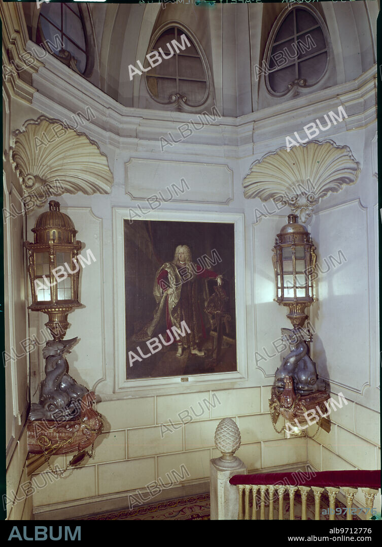 Madrid, 1966. Palace of the Marquise of Santa Cruz. Main staircase with the portrait of José Joaquín de Silva Bazán y Sarmiento, knight of the Order of the Golden Fleece and relevant figure of the Court in the times of Charles III. On both sides the lanterns of the flagships of the French and Portuguese navies, which Álvaro de Bazán defeated in the battle of Terceira (Third) Island.