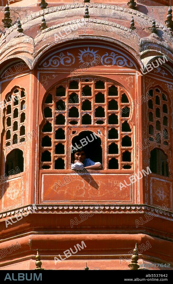 The Hawa Mahal was built in 1799 by Maharaja Sawai Pratap Singh, and designed by Lal Chand Ustad in the form of the crown of Krishna, the Hindu god. Jaipur is the capital and largest city of the Indian state of Rajasthan. It was founded on 18 November 1727 by Maharaja Sawai Jai Singh II, the ruler of Amber, after whom the city was named. The city today has a population of 3.1 million. Jaipur is known as the Pink City of India. The city is remarkable among pre-modern Indian cities for the width and regularity of its streets which are laid out into six sectors separated by broad streets 34 m (111 ft) wide. The urban quarters are further divided by networks of gridded streets. Five quarters wrap around the east, south, and west sides of a central palace quarter, with a sixth quarter immediately to the east. The Palace quarter encloses the sprawling Hawa Mahal palace complex, formal gardens, and a small lake. Nahargarh Fort, which was the residence of the King Sawai Jai Singh II, crowns the hill in the northwest corner of the old city. The observatory, Jantar Mantar, is a World Heritage Site.