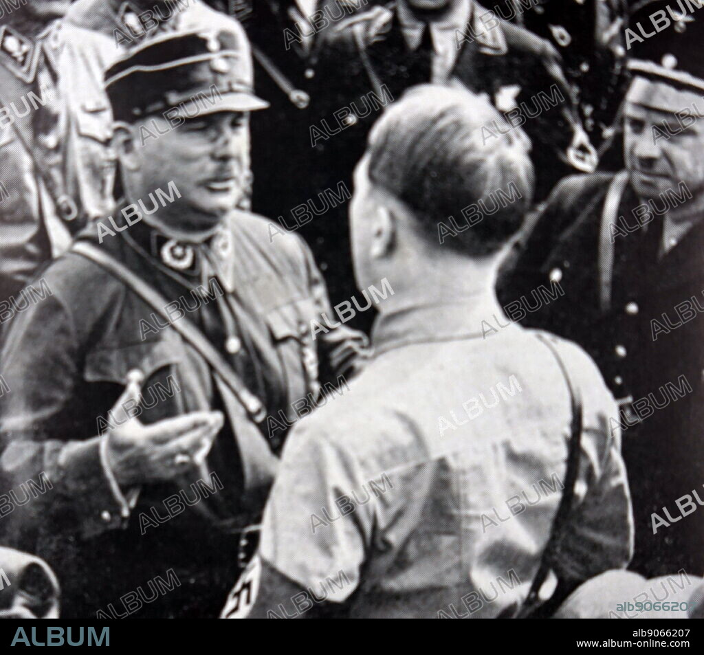 1933. Ernst Rohm (left) talks with Adolf Hitler (1889 1945) the leader of the Nazi Party. Ernst Rohm (1887 1934) was a German military officer and founding member of the Nazi Party. he was a close friend and early ally of Adolf Hitler. In 1934 he was executed during the Night of the Long Knives.