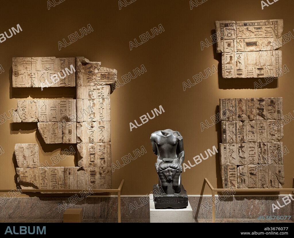 Relief from around the false door in the tomb of Bakenrenef, 3 sections. Dynasty: Dynasty 26. Reign: reign of Psamtik I. Date: 664-610 B.C..
As in the nearby Old Kingdom tombs at Saqqara, the focus of Bakenrenef's tomb was the false door, which was placed on the end wall of the innermost room. The door framed a shallow niche in which had been carved a seated statue representing either Osiris or Bakenrenef himself.
The surviving parts of the doorjamb and lintel give his name and titles, as well as offering prayers addressed to Anubis and Osiris. To the sides are spells from the Book of the Dead, and on the upper right the illustration for the spell for "Entering the Great House/Temple" (Spell 123) is preserved. Part of the text for this spell is preserved in the section below, in the fourth column from the left.
For Curatorial Interpretation of this group of reliefs, see 11.150.50a-d-related.
