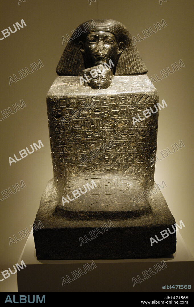 Egyptian Art. Statue-cube of Senenmut and Princess Neferure. Senenmut was architect and royal chancellor during the reign of Hatshepsut and guardian of her daughter, Neferure. Granite sculpture, from Thebes or Karnak. New Kingdom. 18th Dynasty. (1473-1458 B.C.). Egyptian Museum (Altes Museum). Berlin. Germany.