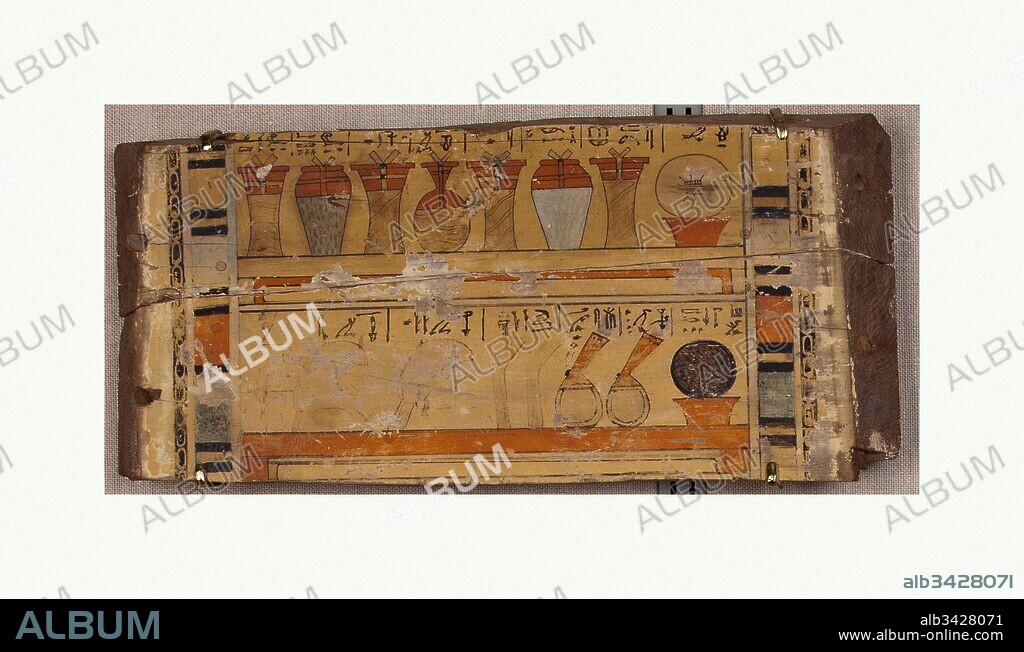 Fragment from the head end of a coffin, Middle Kingdom, Dynasty 12, ca. 1981–1802 B.C., From Egypt, Memphite Region, Lisht South, 1916–17, Cedar wood, l. 51 cm (20 1/16 in); w. 25 cm (9 13/16 in), Found in the surface sand around the pyramid of Senwosret I, this board from the head end of a coffin had been thrown out of its original tomb by robbers. The exterior surface is painted yellow, with inscriptions in blue.