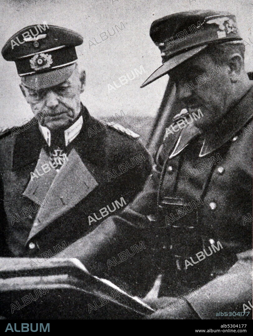 Black and white photograph of World War II (1939-1945); German General Gerd von Rundstedt (1875-1953), commander of the Armies of the South, studies a map before the Battle of Lwow in Ukraine.