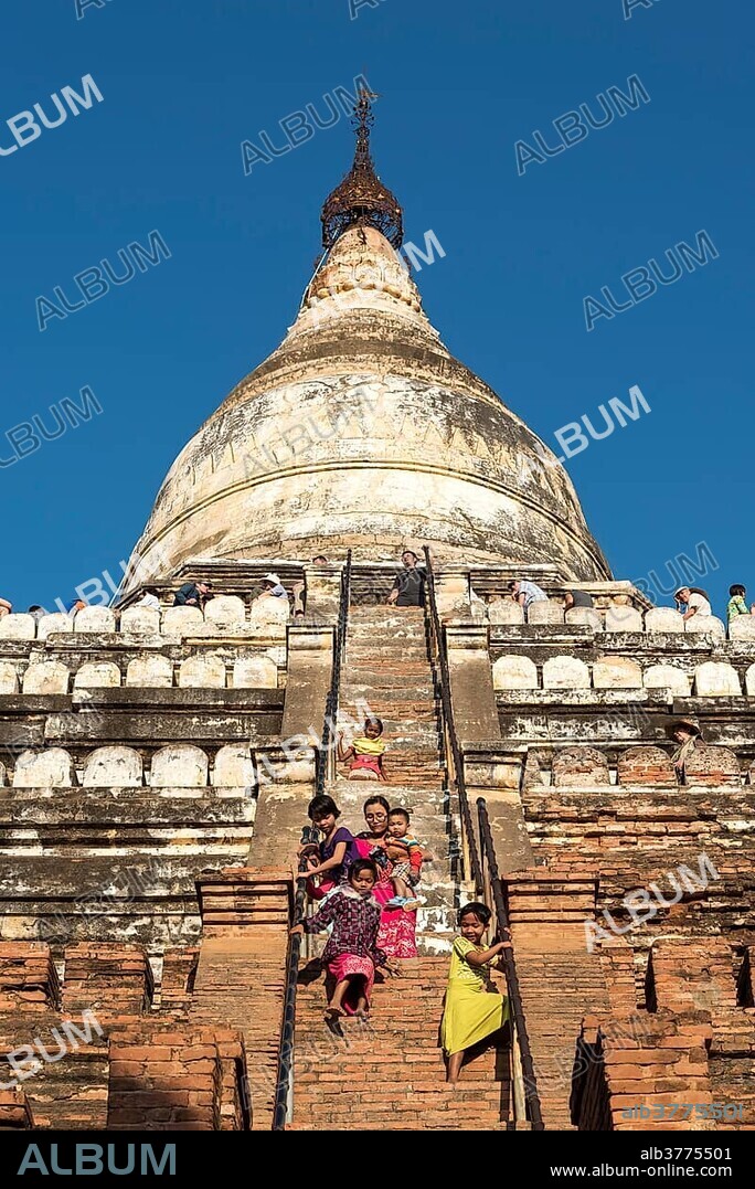 Visitors climb steep steps of Shwesandaw Pagoda, Bagan, Myanmar