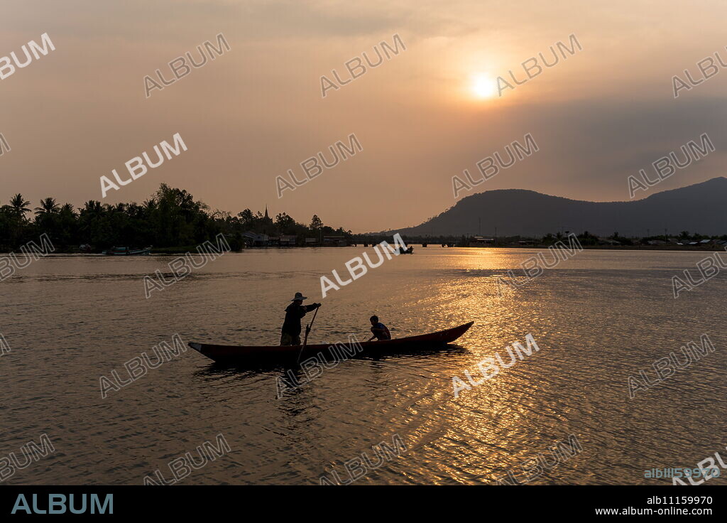 Father and son fishing on Kampong Bay River at sunset, Kampot, Cambodia, Indochina, Southeast Asia, Asia.