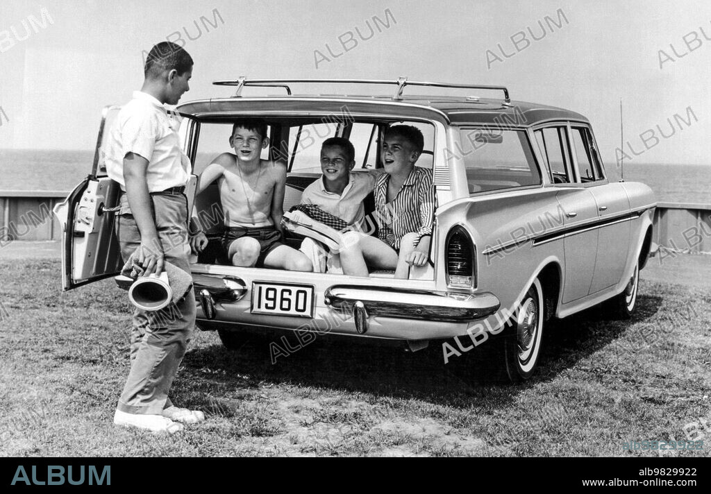 United States 1960, The new three seat Rambler station wagon has one boy wondering where he's gong to sit while three other boys occupy the back. The car featured Captive-Air tires, which eliminated the need to carry a spare.