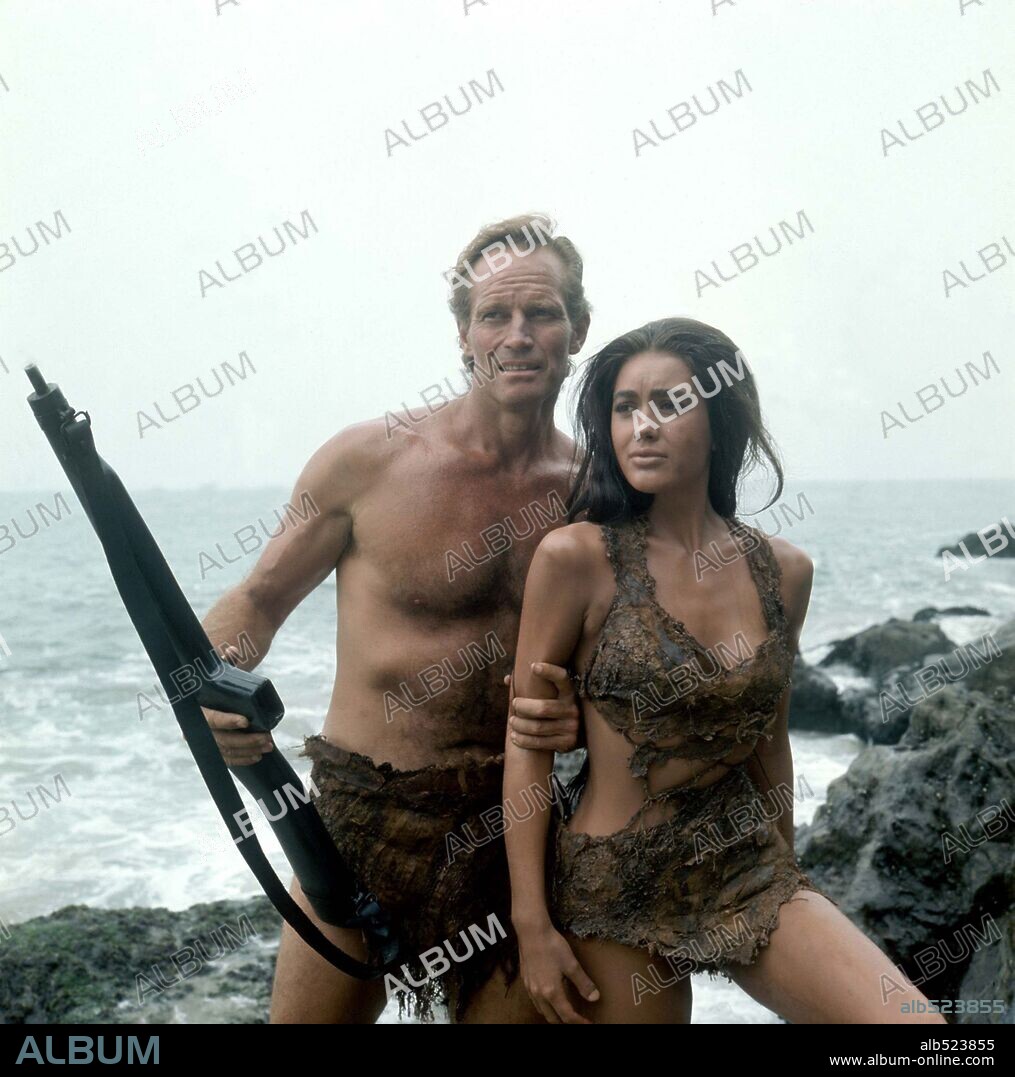 CHARLTON HESTON and LINDA HARRISON in PLANET OF THE APES, 1968, directed by FRANKLIN J. SCHAFFNER. Copyright 20TH CENTURY FOX.