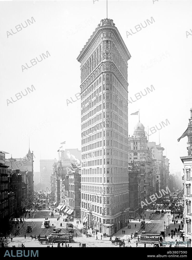 The Flatiron Building, originally the Fuller Building, is located at 175 Fifth Avenue in the borough of Manhattan, New York City, and is considered to be a groundbreaking skyscraper. The building sits on a triangular island-block formed by Fifth Avenue, Broadway and East 22nd Street, with 23rd Street grazing the triangle's northern peak. As with numerous other wedge-shaped buildings, the name "Flatiron" derives from its resemblance to a cast-iron clothes iron. The Flatiron Building was designed by Chicago's Daniel Burnham as a vertical Renaissance palazzo with Beaux-Arts styling. It epitomizes the Chicago school conception: like a classical Greek column, its facade is divided into a base, shaft and capital. The building was designated a New York City landmark in 1966, was added to the National Register of Historic Places in 1979, and designated a National Historic Landmark in 1989. Photographed by the Detroit Publishing Company, 1903.