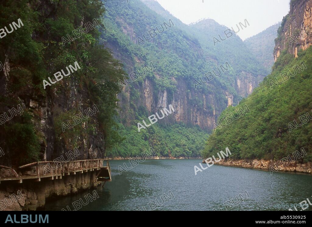 The Three Gorges or Yangtze Gorges span from the western—upriver cities of Fengjie and Yichang in Chongqing Municipality eastward—downstream to Hubei province. The Yangtze River (Chang Jiang)—Three Gorges region has a total length of approximately 200 kilometres (120 mi). The Three Gorges occupy approximately 120 kilometres (75 mi) within this region.  The Chang Jiang (Yangzi River) is the longest river in China and third longest in the world. Known upstream as the Golden Sand River, it flows through the geographical, spiritual and historical heart of China. From its source in the Tanggula Mountains of Qinghai province, the Yangzi flows southeast through Tibet as the Tongtian, turns south, then north as the Jinsha, and becomes the Yangzi proper after Yibin in Sichuan. Here, it swings eastwards once again, crossing Hubei, Hunan, Jiangxi, Anhui and Jiangsu provinces to reach the East China Sea at Shanghai. Its source-to-mouth length is 6,300 km (3,915 miles).