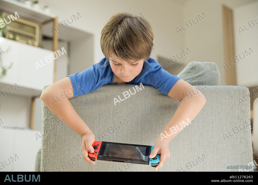 Boy playing video game.