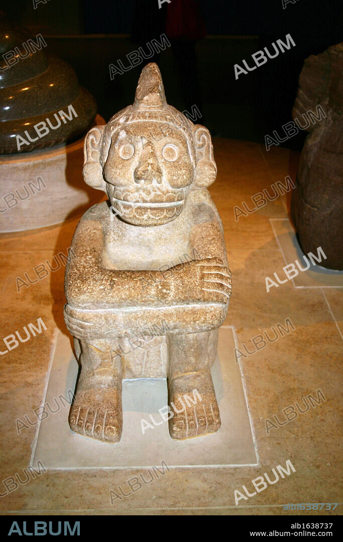 Seated sandstone figure of Mictlantecuhtli: Aztec, AD 1325-1521. Mexico. Mictlantecuhtli was an Aztec god associated with death. Pre-Columbian Mesoamerican Mythology. Sculpture.