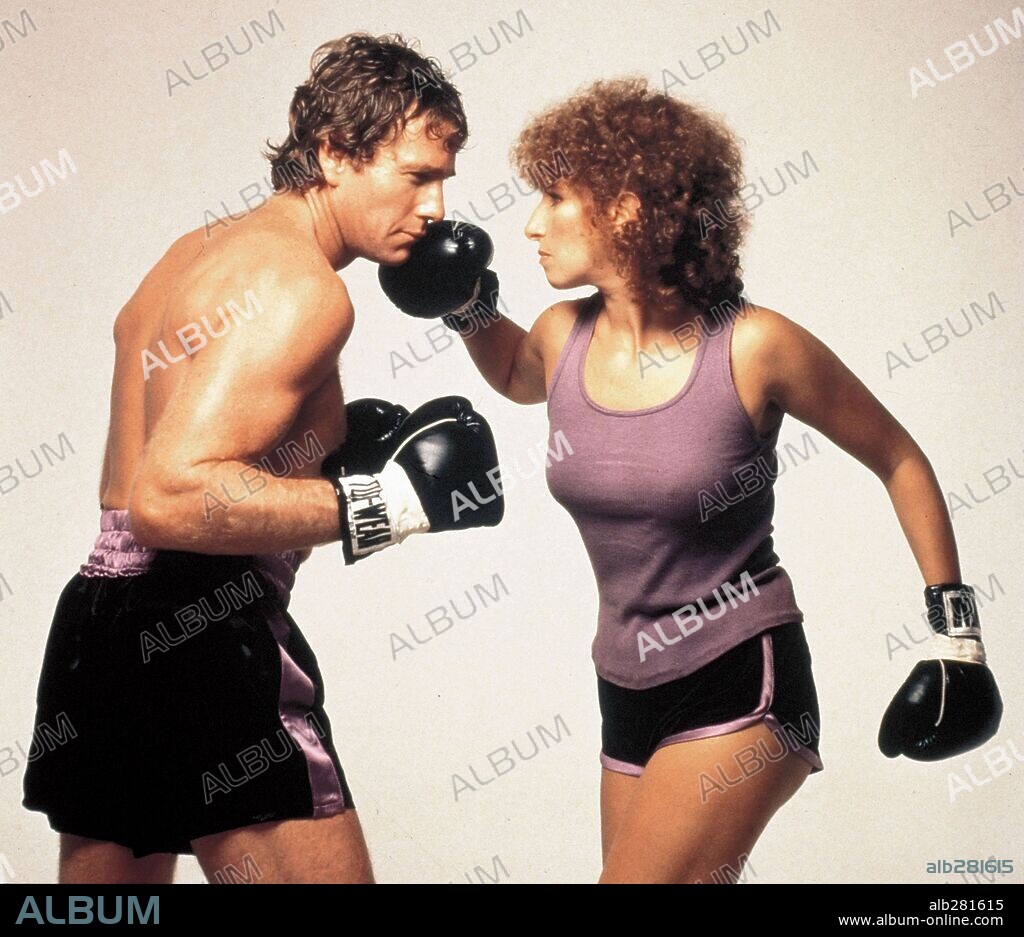 RYAN O'NEAL and BARBARA STREISAND. BARBRA STREISAND and RYAN O'NEAL in THE MAIN EVENT, 1979, directed by HOWARD ZIEFF. Copyright WARNER BROTHERS.