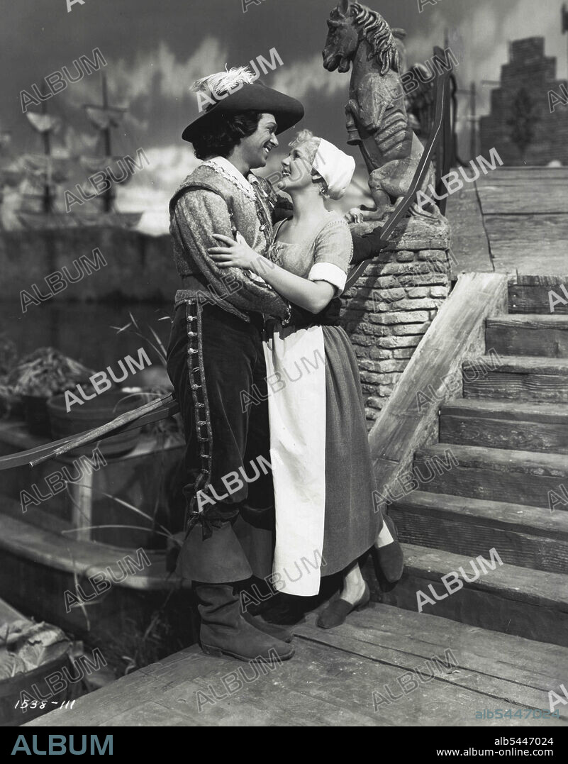The Exile - Charles (Douglas Fairbanks) and Katie (Paule Croset) take a walk through the market place to watch the barges loading. Douglas Fairbanks and Paule Croset, co-starred with Maria Montez in "The Exile" (Lyeeum). December 19, 1947. (Photo by Universal-International).