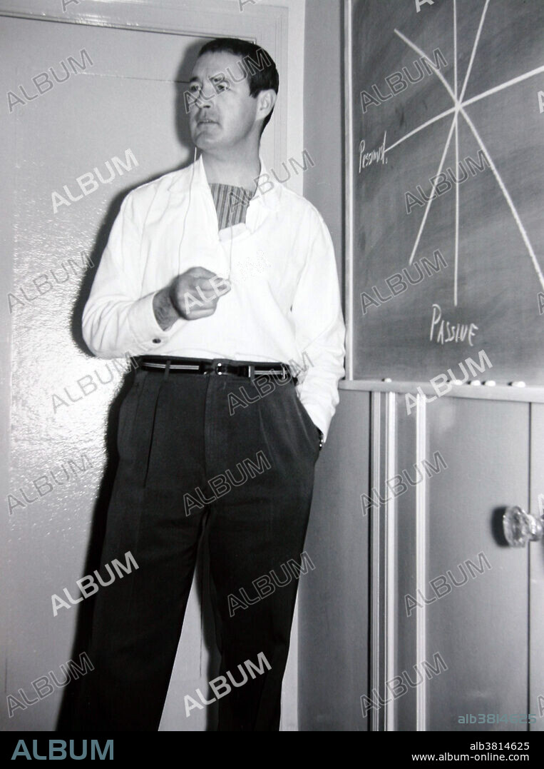 Editorial use only . Leary giving a lecture on his first book, Interpersonal Diagnosis of Personality, circa 1950's. Timothy Francis Leary (1920-1996), American psychologist and writer, known for his advocacy of psychedelic drugs. During a time when drugs such as LSD and psilocybin were legal, Leary conducted experiments at Harvard University under the Harvard Psilocybin Project, resulting in the Concord Prison Experiment and the Marsh Chapel Experiment. Both studies produced useful data, but Leary and his associate Richard Alpert were fired from the university because of the public controversy surrounding their research. Leary believed LSD showed therapeutic potential for use in psychiatry. He popularized catchphrases that promoted his philosophy such as turn on, tune in, drop out.