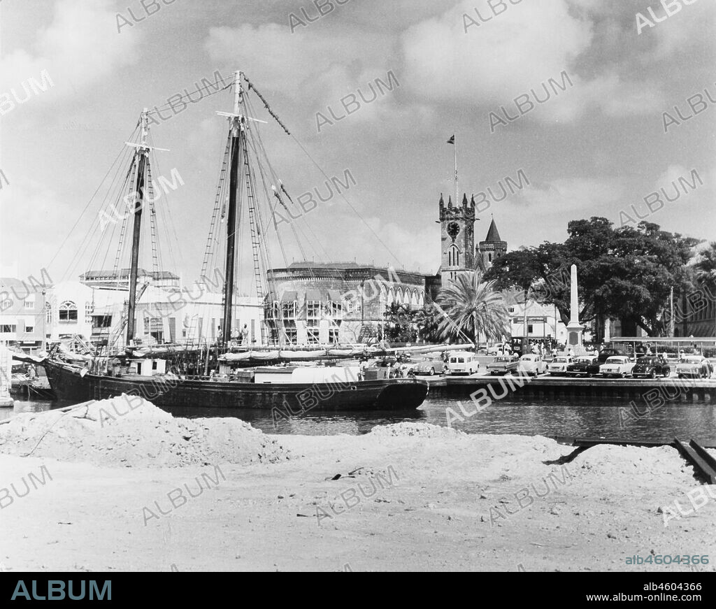 Barbados, A ketch (twin-masted sail boat) sits at anchor in the Careenage. Bridgetown, Barbados, 1965, 1965. 2005/010/1/13/27.