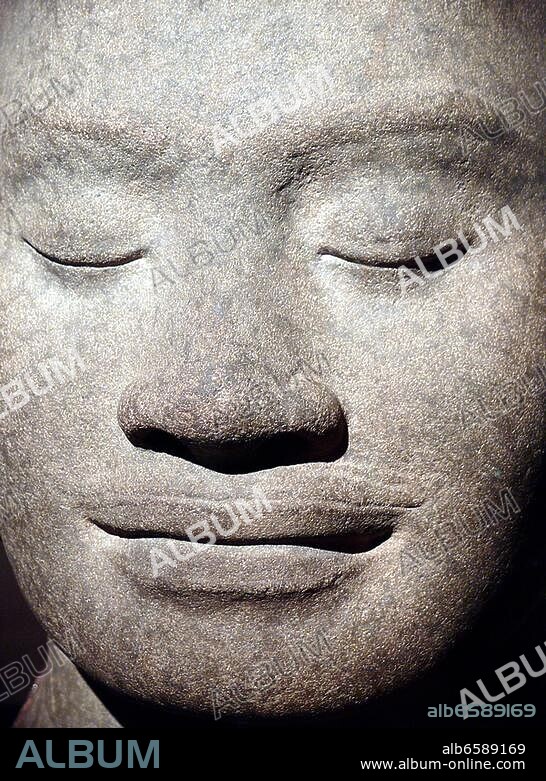 Jayavarman VII King from 1181 to about 1218,in the Khmer Empire, a beliver of the Mahayana Buddhism, the statue shows the king in a state of thought , the hair style with the extra lobe at the top of.