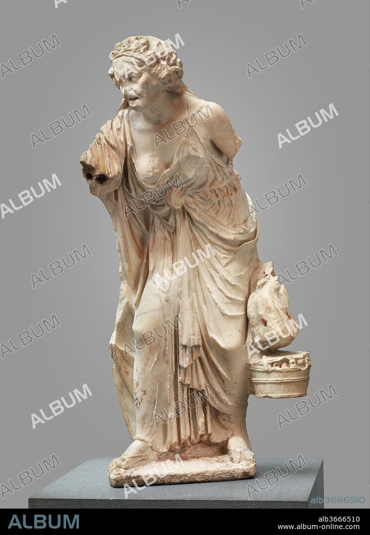 Marble statue of an old woman. Culture: Roman. Dimensions: H. 49 5/8 in. (125.98 cm). Date: A.D. 14-68.
Copy of a Greek work of the second century B.C.
During the Hellenistic period, artists became concerned with the accurate representation of childhood, old age, and even physical deformity. The range of subject matter was extended to include genre-like figures from the fringes of society. Fine, large-scale statues of fishermen, peasants, and aged courtesans became valued religious dedications, sometimes placed in a park-like setting within the
sanctuary of the god. Although this statue is known familiarly as The Old Market Woman, it probably represents an aged courtesan on her way to a festival of Dionysos, the god of wine. Her delicate sandals and the ample material in her thin, elaborately draped chiton are a far cry from the rough garb of a peasant woman. The ivy wreath on her head marks her association with Dionysos, and the basket of fruit and the two chickens must be dedicatory gifts to the god or simply her own provisions for a long day of celebration. Veneration of Dionysos was widespread
during the Hellenistic period, and ancient literary descriptions give an idea of the extraordinary processions and festivals held in his honor. The flattened composition of the figure is typical of sculpture created in the late second century B.C. The original work may have been dedicated in a sanctuary of Dionysos. The Roman copy could have decorated a garden.