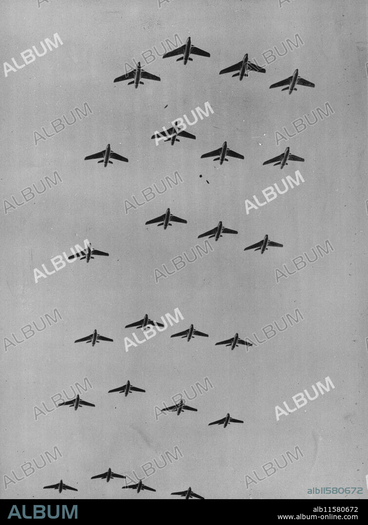 Hawker Hunters In Service With R.A.F. -- A general view taken from the ground of Hawker Hunter jet fighters in flight.Three squadrons of Fighter Command Royal Air Force are now fully equipped with Hawker Hunter jet fighters. One of them is the R.A.F. Station at Wittisham, Suffolk. The Hawker Hunter is a single seat day fighter. The Mark 1 is powered by a single Rolls Royal Avon turbijet, and the Mark 2 by an Armstrong Siddaley Sapphire. The Hunter is a swept-back mid-wing monoplane, the moderate wing loading and high power loading ensure and is very mandeuvrable at high altitudes where trans-sonic speeds may be attained in dives of relatively shallow angle. February 16, 1955.