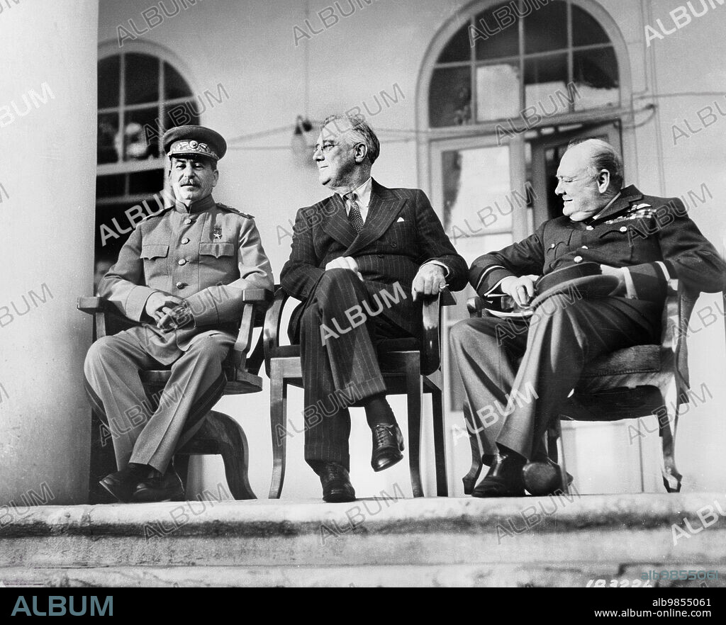 Soviet General Secretary Josef Stalin, U.S. President Franklin Roosevelt, British Prime Minister Winston Churchill, on porch of Russian Embassy during Tehran Conference, Tehran, Iran, U.S. Army Signal Corps, November 1943.