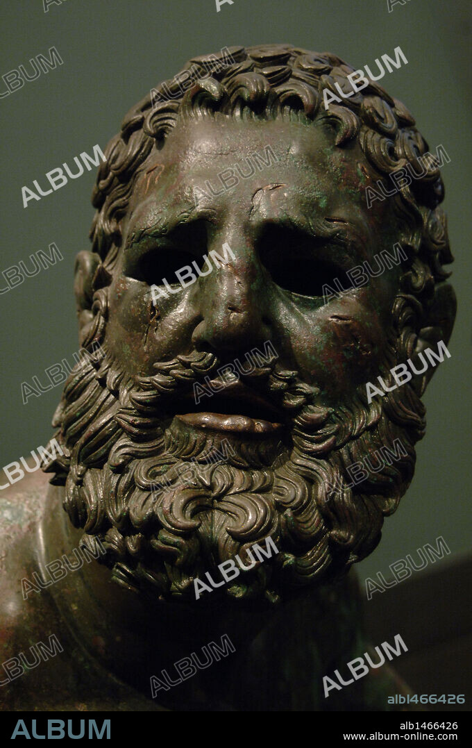 Greek Art. Hellenistic. Boxer of Quirinal or the Terme Boxer. Bronze sculpture of the Hellenistic period (1st century B.C.). Boxer sitting at rest, with metal and leather dressings used for combat. Palazzo Massimo. National Roman Museum. Rome. italy.