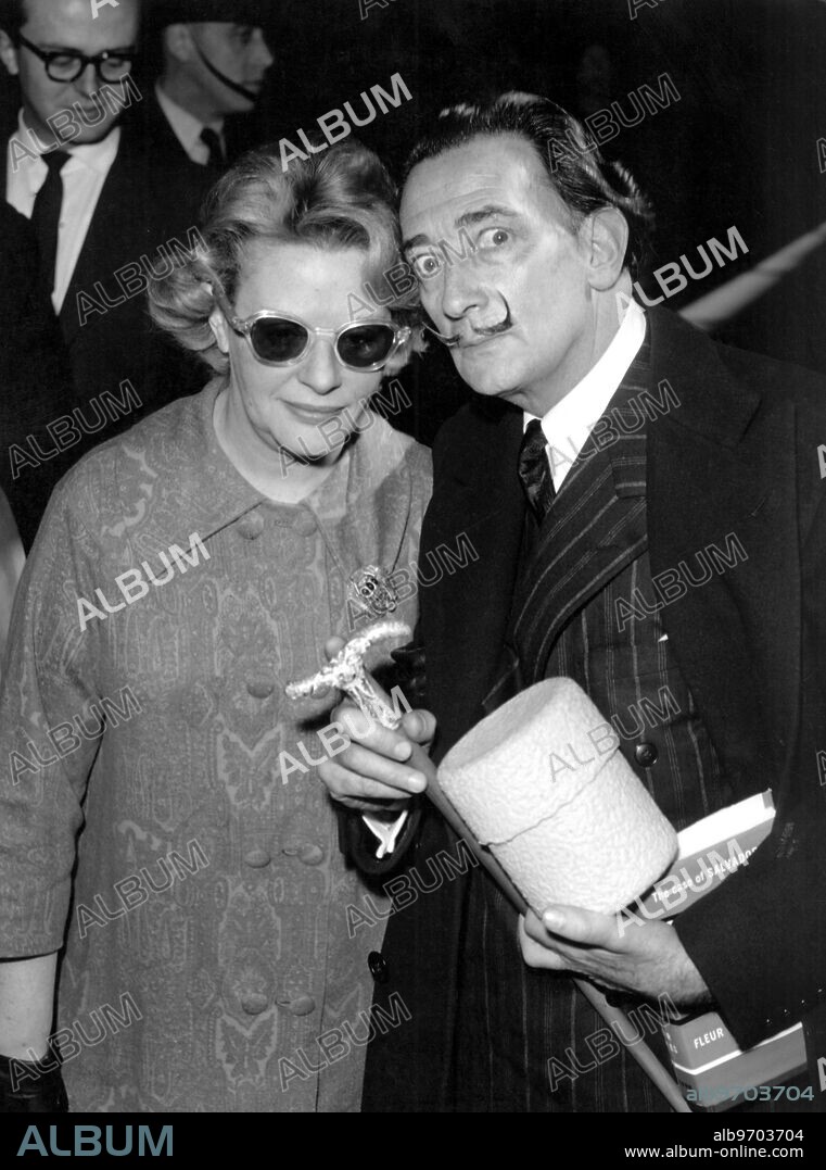 Spanish surrealist painter Salvador Dali with Fleur Cowles, author of the book "The Case for Salvador Dali", in London in 1959. Dali died today aged 84 at the district hospital in his home town of Figuerax, in north-east Spain. he had been suffering from heart trouble and pnuemonia.. 23 Janaury 1989.