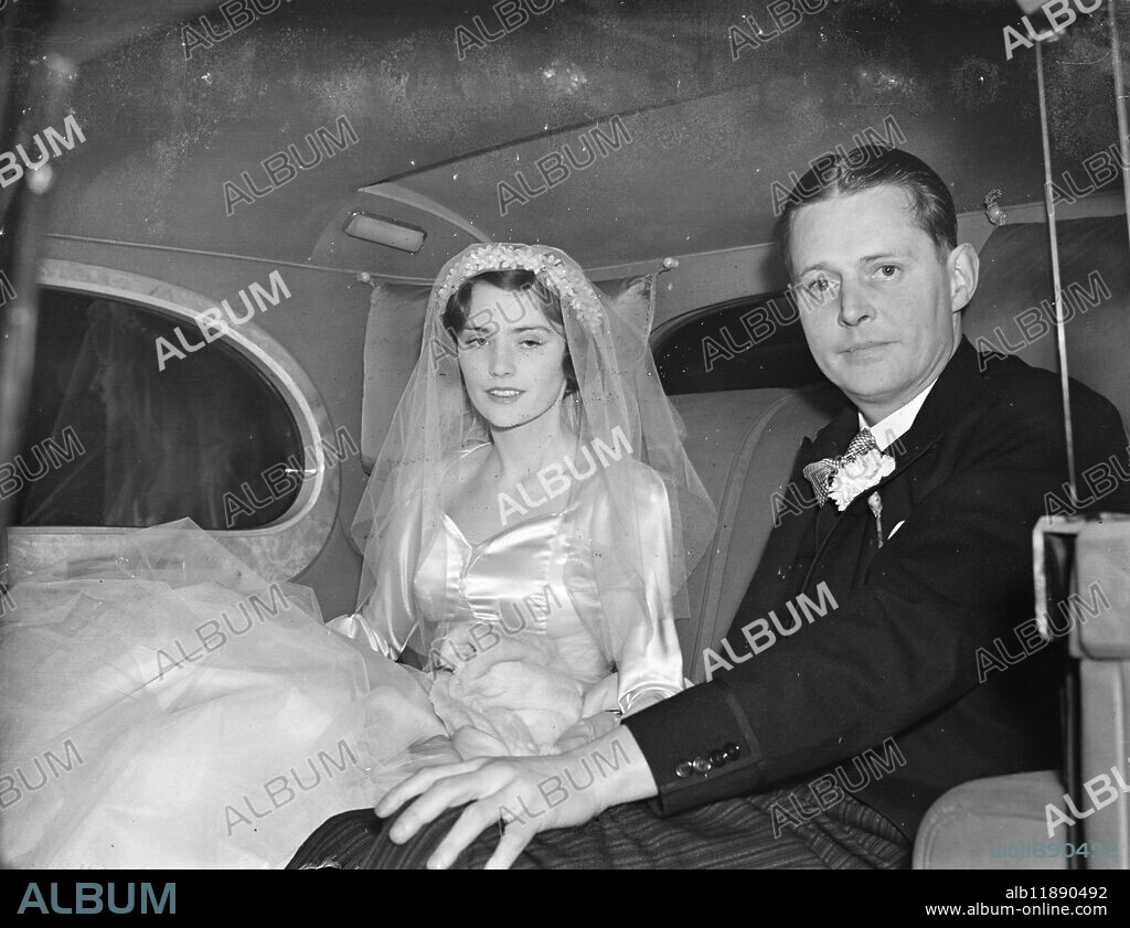Lady Patricia Douglas Leas with father for wedding to Count John de Bendern. Lady Patricia Douglas, daughter of Lady Dunn and the Marquess of Queensberry, was married at Brompton Oratory to Count John de Bendern, son of Count and Countess de Bendern and British amateur golf title in 1932. Count John was then called John de Forest, but changes his name by deed poll on his father becoming Count von Bendern of Lichtenstein. Photo shows, Lady Patricia Douglas and her father, the Marquess of Queensberry, driving from the home of the brides mother, Norwich House, Norfolk Street, to the wedding. 27 January 1938.