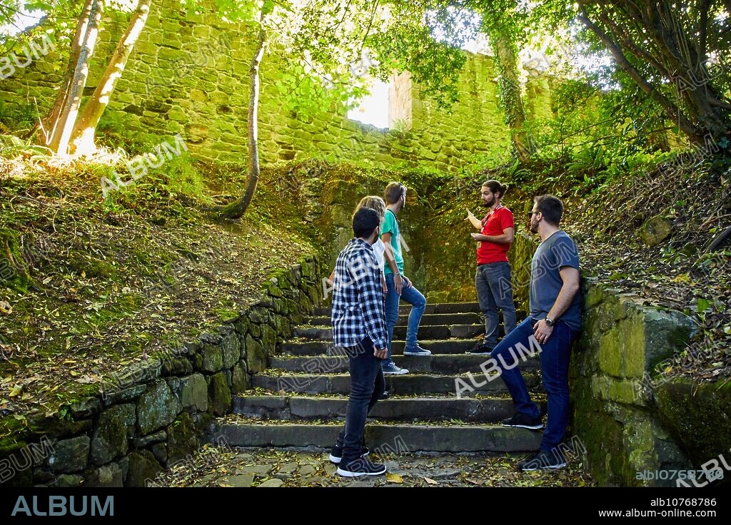 Group of tourists and guide making a tour of the city, Climb to Mount Urgull, Castillo de la Mota, Donostia, San Sebastian, Gipuzkoa, Basque Country, Spain, Europe.