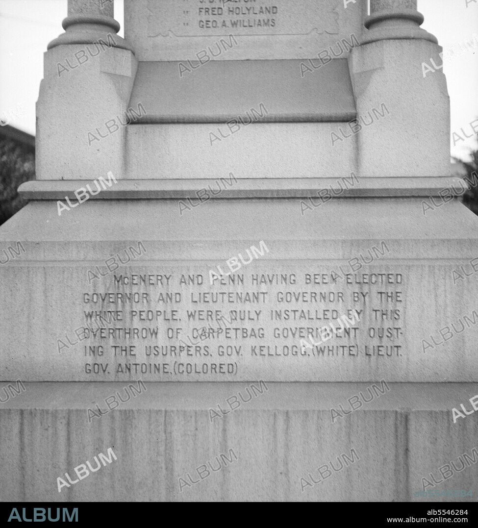 DOROTHEA LANGE. One side of the monument erected to race prejudice. New Orleans, Louisiana. [McEnery and Penn having been elected governor and lieutenant-governor by the white people, were duly installed by this overthrow of carpetbag government, ousting the usurpers, Governor Kellogg (white), Lieutenant-Governor Antoine (colored).