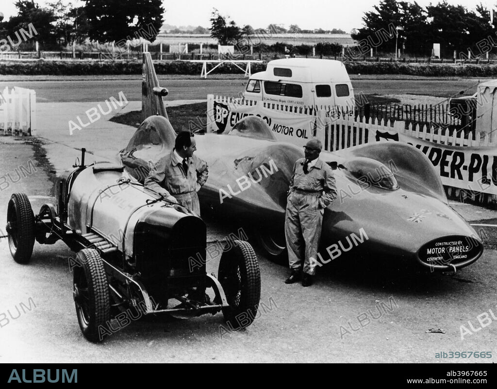 Donald Campbell with a Sunbeam 350 and Leo Villa with Bluebird, c1964.  Malcolm Campbell, Donald's father, bought a Sunbeam 350 in 1923 and modified it to become the first man to exceed 150 mph on land at Pendine sands on 21st July 1925. Leo Villa was an engineer involved with both Donald and Malcolm Campbell, on all their Bluebird record attempts. Campbell was the first person to complete an officially timed run with a jet-propelled hydroplane, on 23rd July 1955, at Lake Ullswater, achieving a speed of 202.32 mph (325 kmph). On 31st December 1964, he beat this record at Dumbleyung Lake, Australia, with a speed of 276.33 mph (444.6 kmph). On 17th July 1964 he set a speed record on land with a jet-powered Class A land vehicle, with a speed of 403.1 mph (649 kmph), at Lake Eyre Salt Flats, Australia. He is the first and thus far only person to hold both Water and Land Speed Records. He died on 4th January 1967 on Coniston Water, Cumbria whilst attempting to beat his own world record of 276 mph at a speed close to 320 mph on his return run.
