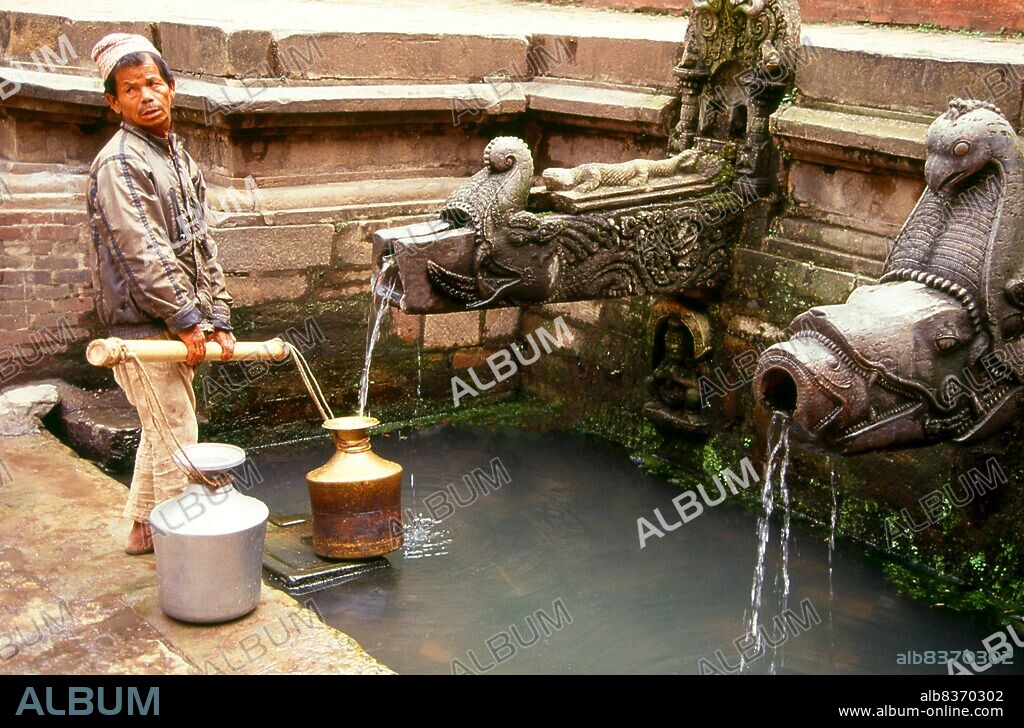 The Tusha Hiti is a well lined with stone carvings portraying numerous deities. It was formerly used as a royal bath. The figures depicted are the eight mother goddesses, the eight serpent gods and the eight Bhairavs. The outer perimeter of the tank is encircled by two carved naga, or snake deities, which are traditionally associated with tanks or wells and believed to ensure an uninterrupted water supply.<br/><br/>. The Royal Palace supposedly dates back to the Licchavi period (5th-13th century), but, with the exception of a few inscriptions, there is little substantial evidence for this. In the earliest inscription, which hails from the year 643 CE and which was found at the Keshav Narayan Chowk, Licchavi King Narendra Deva announced the abolition of three types of taxes, presumably making him popular with his subjects. This indicates that there may at the time have been a palace at the site of Keshav Narayan Chowk, which is part of the present royal palace complex.<br/><br/>. The royal palace as seen today in Durbar Square has its origins in the 14th century; however, the most active building period was the 17th century.