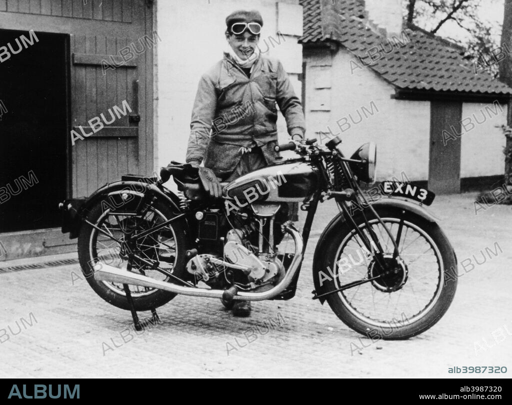 Donald Campbell outside a garage at Headley Grove, Surrey, 1938. Campbell was the first person to complete an officially timed run with a jet-propelled hydroplane, on 23rd July 1955, at Lake Ullswater, achieving a speed of 202.32 mph (325 kmph). On 31st December 1964, he beat this record at Dumbleyung Lake, Australia, with a speed of 276.33 mph (444.6 kmph). On 17th July 1964 he set a speed record on land with a jet-powered Class A land vehicle, with a speed of 403.1 mph (649 kmph), at Lake Eyre Salt Flats, Australia. He is the first and thus far only person to hold both Water and Land Speed Records. He died on 4th January 1967 on Coniston Water, Cumbria whilst attempting to beat his own world record of 276 mph at a speed close to 320 mph on his return run.