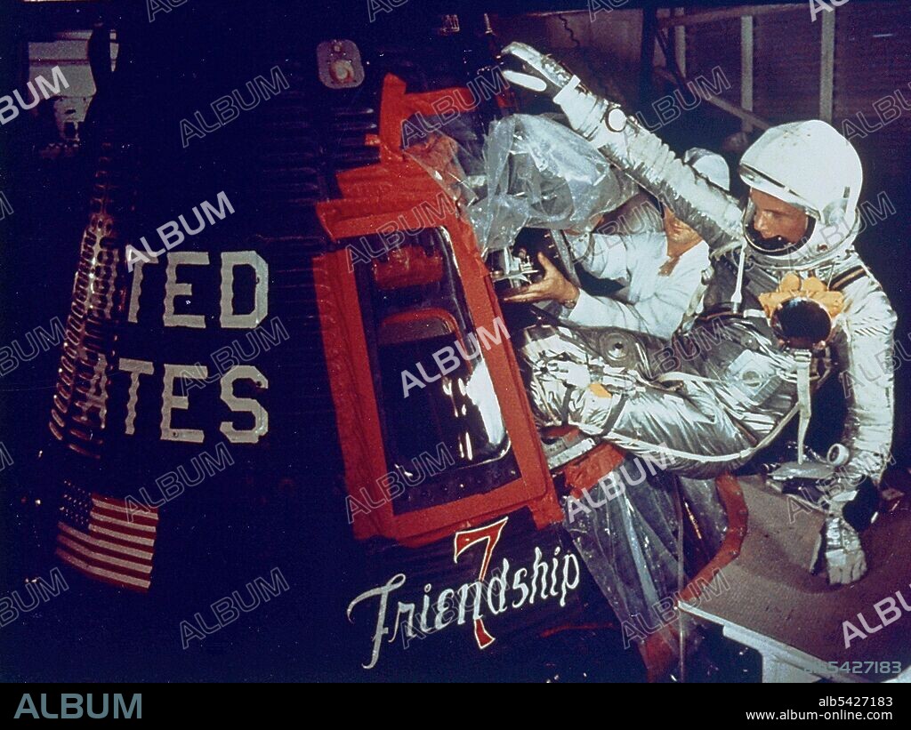 Friendship 7, February 20, Florida, USA, 1962. At 9:47 am EST, astronaut John Glenn launched from Cape Canaveral's Launch Complex 14 to become the first American to orbit the Earth. In this image, Glenn enters his Friendship 7 capsule with assistance from technicians to begin his historic flight.