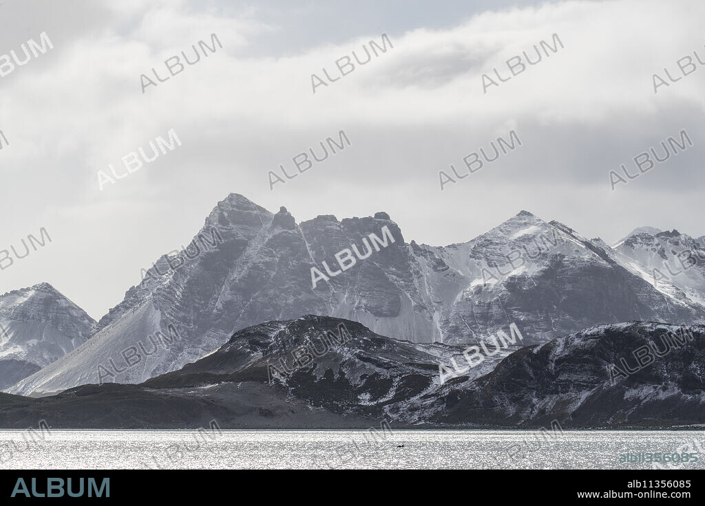 A fresh dusting of snow covers the mountains surrounding Salisbury Plain, South Georgia, UK Overseas Protectorate, Polar Regions.