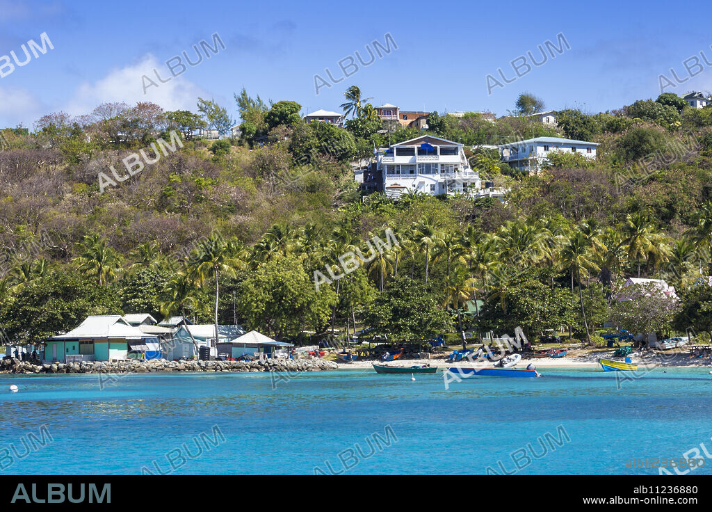 View of Lovell village, Mustique, The Grenadines, St. Vincent and The Grenadines, West Indies, Caribbean, Central America.