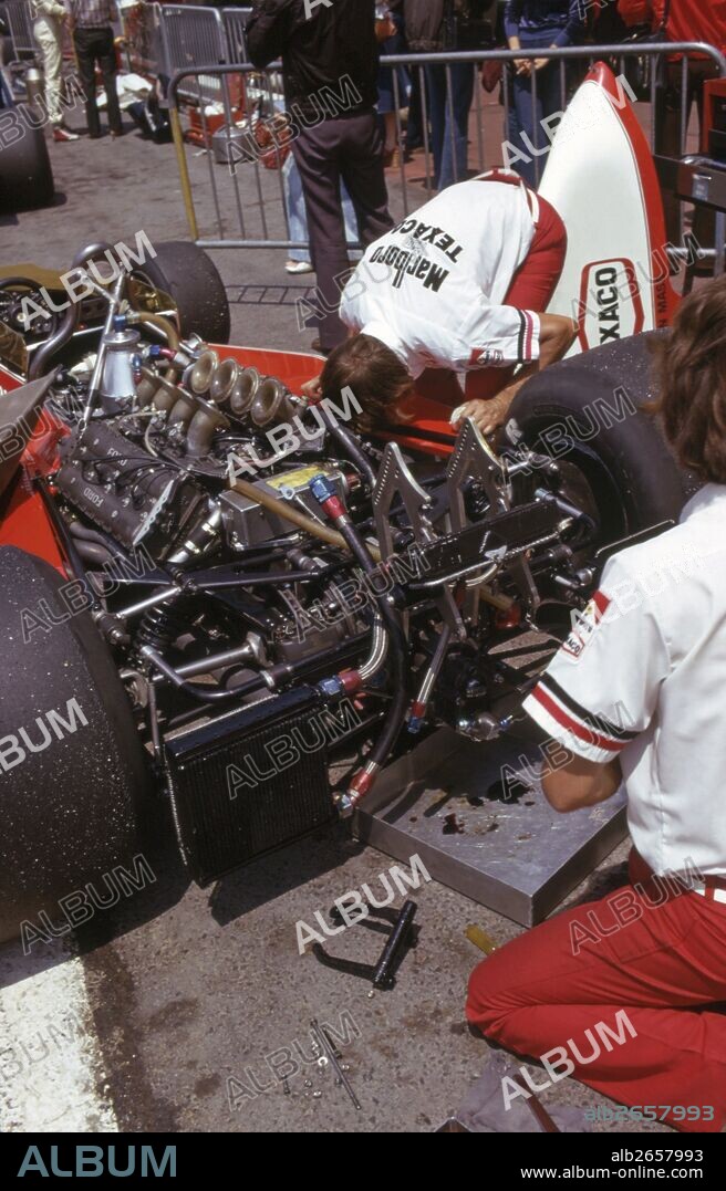 McLaren M23 car with Cosworth DFV engine, gearbox taken apart in the pits 1976.