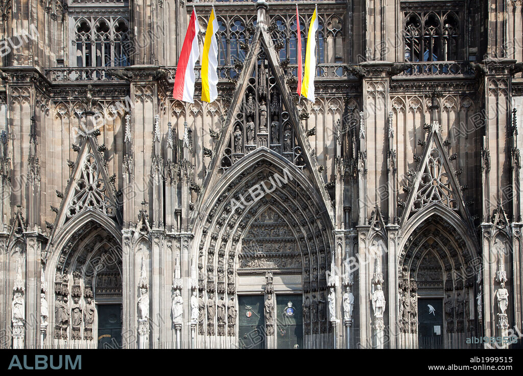 Germany, Cologne, Cologne Cathedral, Southern Facade, General View. Cologne Cathedral was built was built to house the relics of the Three Magi, under the direction of Archbishop Conrad von Hochstaden. Construction of the present Gothic church began in August 15th, 1248 and completed in 1880. In 1996, the cathedral was added to the UNESCO world heritage list of culturally important sites.