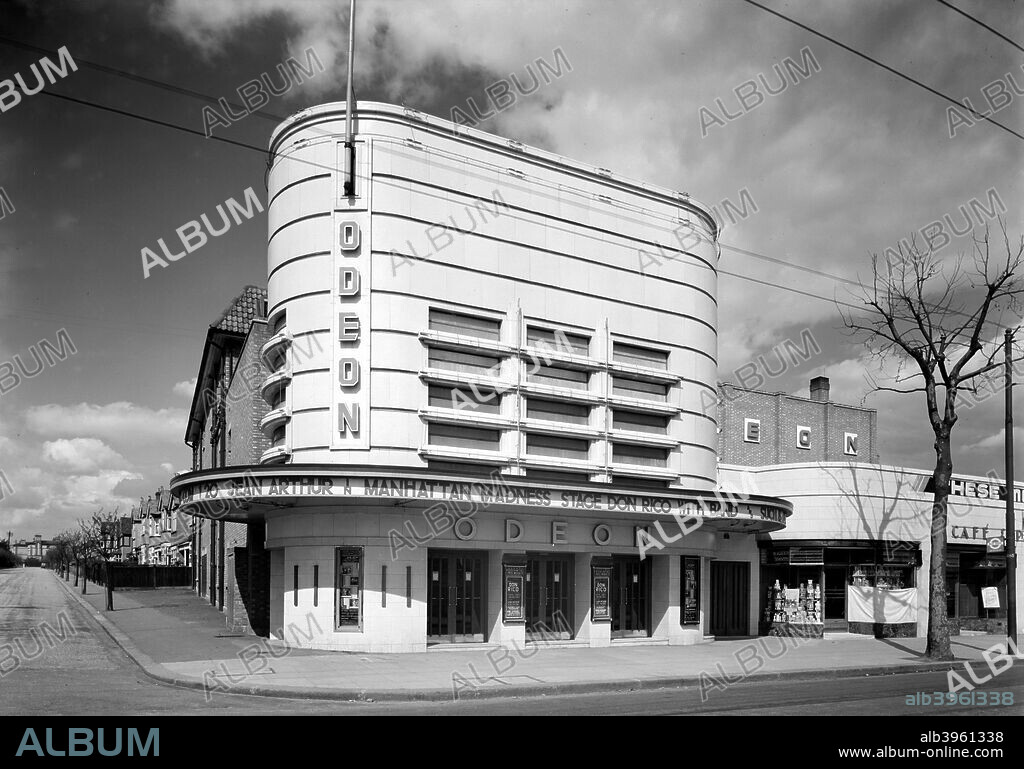 Street view of the Odeon cinema, Isleworth, London, c1935. The frontage makes extensive use of strong horizontal lines with rounded corners, typical of contemporary Art Deco style. Built by George Coles in 1937, it was closed in 1957.