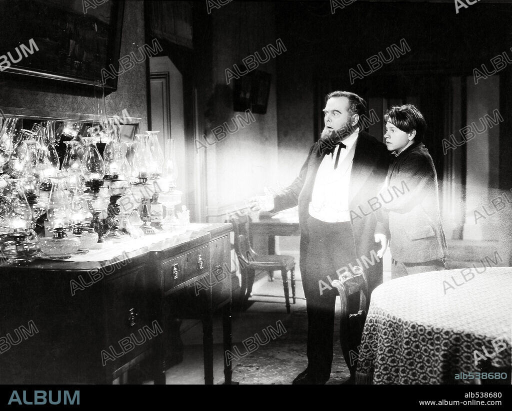 LLOYD CORRIGAN and MICKEY ROONEY in YOUNG TOM EDISON, 1940, directed by NORMAN TAUROG. Copyright M.G.M.