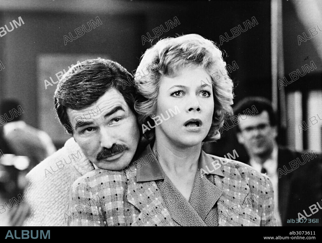 BURT REYNOLDS and KATHLEEN TURNER in SWITCHING CHANNELS, 1988, directed by TED KOTCHEFF. Copyright TRI STAR PICTURES.
