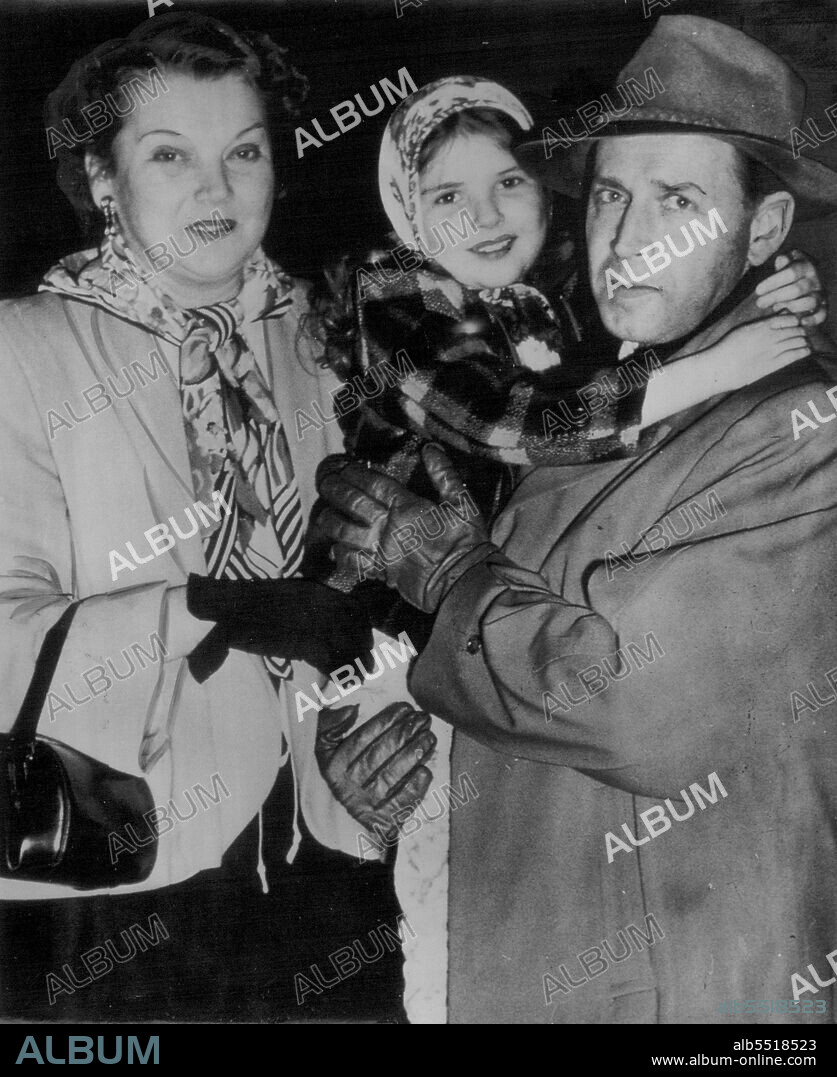 Runaway Child Actress -- Lora Lee Michael, nine-year-old veteran of 17 movie roles, is held by Sheriff's deputy M. T. Johnson with Dep. Bess Bailey after the child fled in nightclothes From home of her foster parents. Lora Lee told deputies that her foster mother, Mrs. Lorraine Miche1,55, withheld food from her so that she could keep size down for small girl roles, Mrs. Michel denied charge emphatically. March 14, 1950. (Photo by AP Wirephoto).