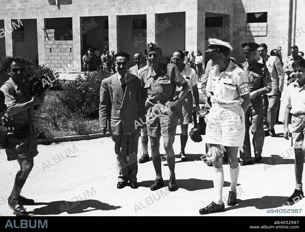 Count Folke Bernadotte (1895-1948) with UN men in the hall of the National Institutions. Count Folke Bernadotte was noted for his negotiation for the release of prisoners from the German concentration camps in World War II. He was vice-president of the Swedish Red Cross. Became the United Nations' mediator in Palestine. He was assassinated, along with UN observer Colonel André Serot, on September 17th in Jerusalem by members of the Zionist extremist Stern gang.