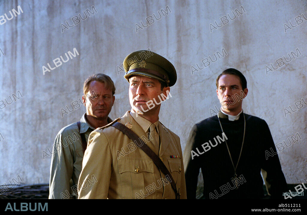JAMES D'ARCY, JULIAN WADHAM and STELLAN SKARSGARD in EXORCIST: THE BEGINNING, 2004, directed by RENNY HARLIN. Copyright WARNER BROS. PICTURES.