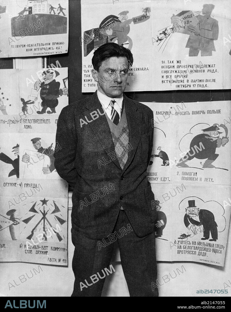 Vladimir mayakovsky, soviet poet, playwright and graphic artist (1894-1930) with some of his propaganda posters, this photo was taken two months before his death.