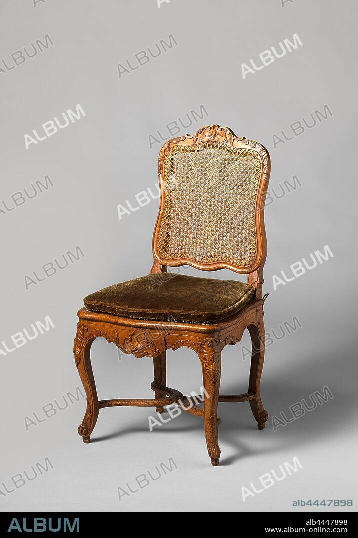 Chair made of walnut and beech wood with S shaped angled legs X