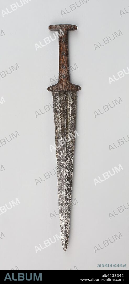 Baselard. French, possibly Swiss. Date: 1400-1500. Dimensions: L. 40 cm (15 3/4 in.)
Blade L. 28.5 cm (11 1/4 in.)
Wt. 10.5 oz. Wood and steel. Origin: France.