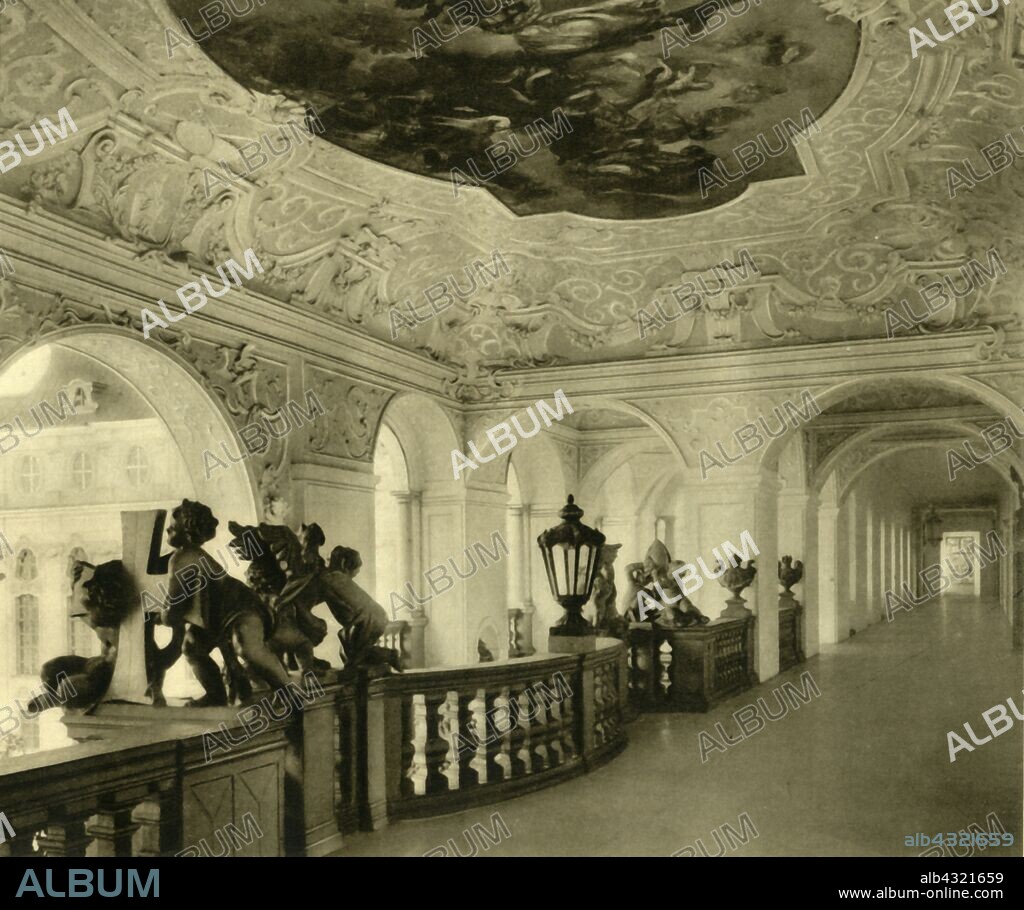 Imperial staircase, St Florian Monastery, Sankt Florian, Upper Austria, c1935. Balustrade decorated with marble chuerubs, with decorative plasterwork and ceiling frescoes by Bartolomeo Altomonte. The Augustinian monastery dedicated to St Florian was founded in the ninth century. It was rebuilt between 1686 and 1708 in Baroque style by Carlo Antonio Carlone. From "Österreich - Land Und Volk", (Austria, Land and People). [R. Lechner (Wilhelm Müller), Vienna, c1935].